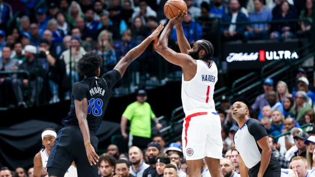 Dallas Mavericks rookie Olivier-Maxence Prosper attempts to block Los Angeles Clippers star James Harden.